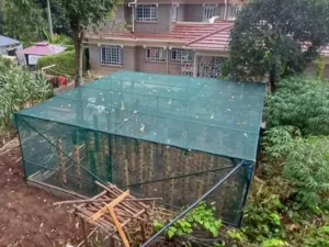 A shade net installation featuring tower hydroponics farming.